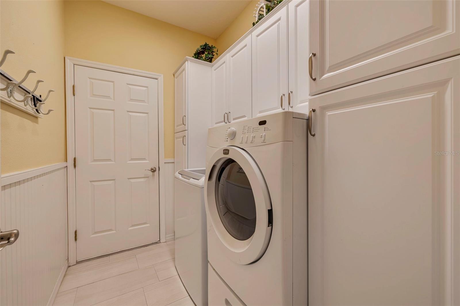 Laundry Room With Ample Storage Cabinets