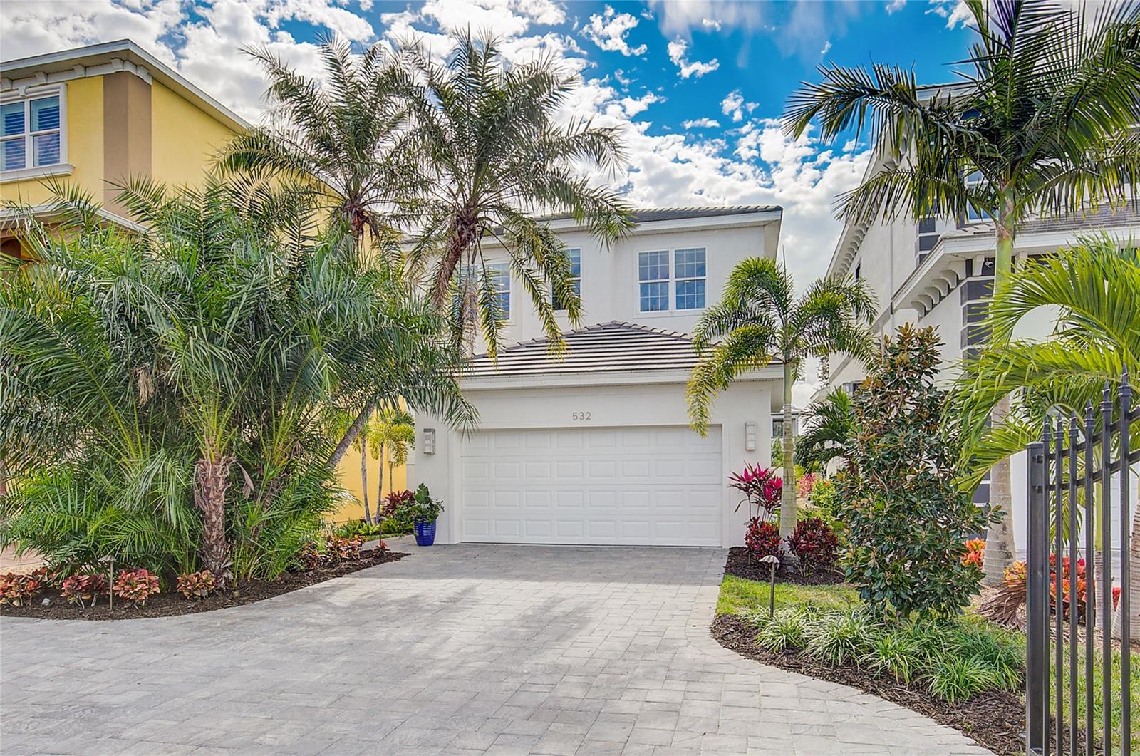 PRIVATE GATED ENTRANCE WITH TROPICAL FLORIDA FEEL AWAITS YOU!