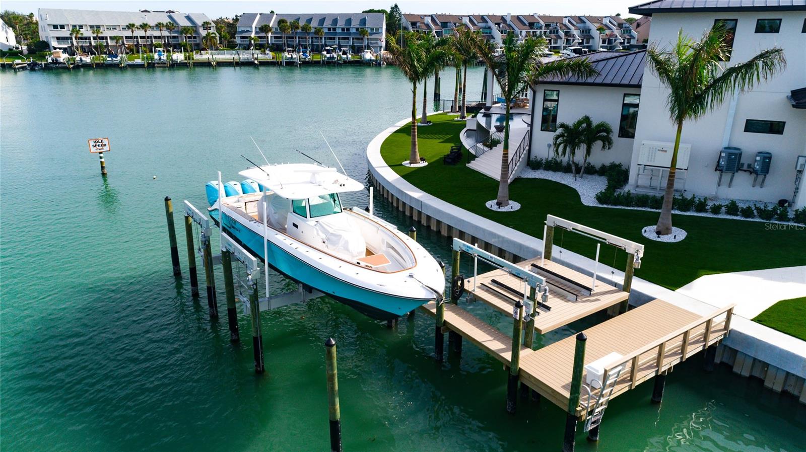 2 Boat Lifts: 1one accommodating a pair of Jet Skis and another robust 40,000-pound lift designed for a 52-foot boat.