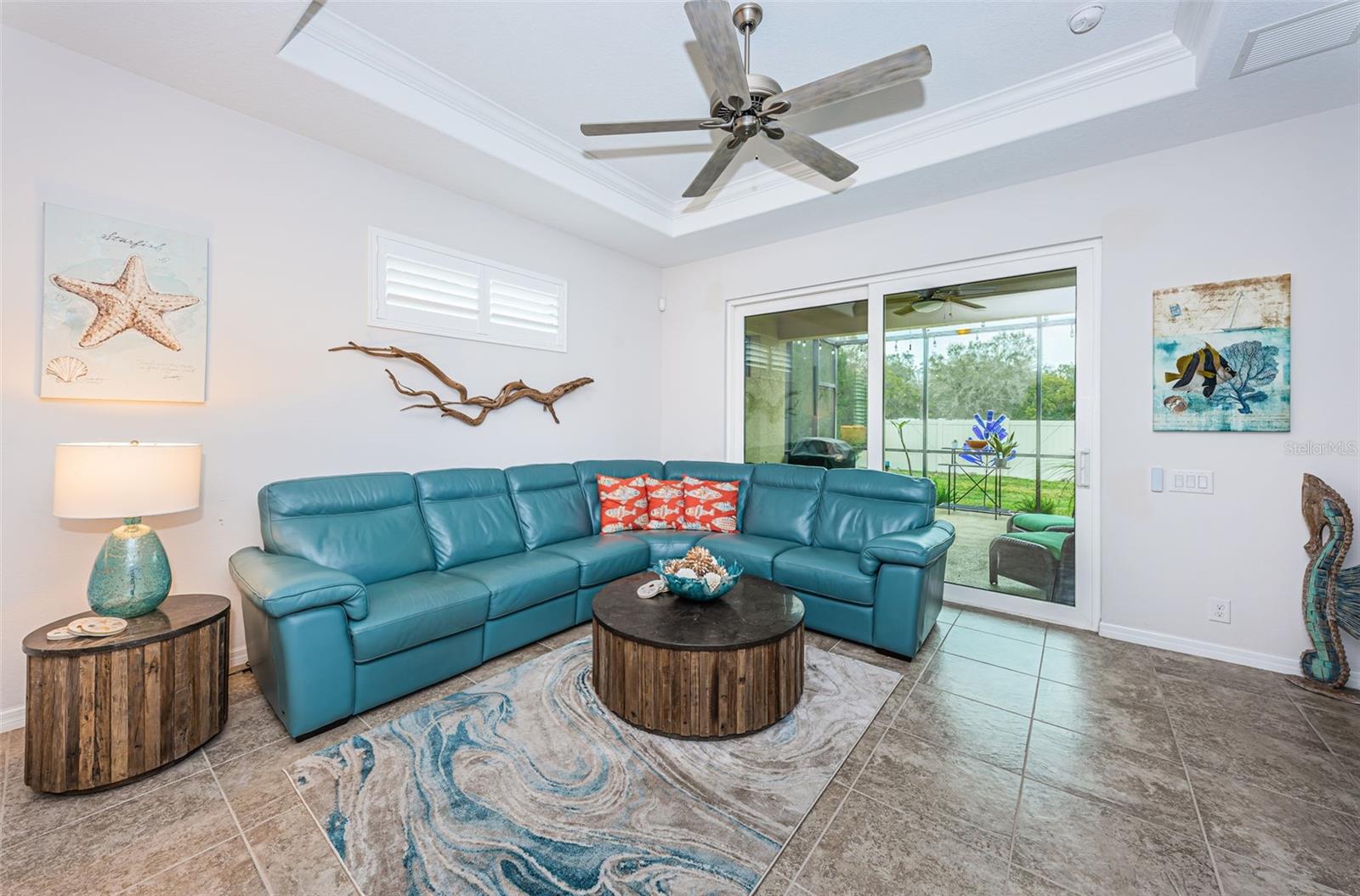 Large Living Room with a walkout to your sizable covered and screened Lanai!