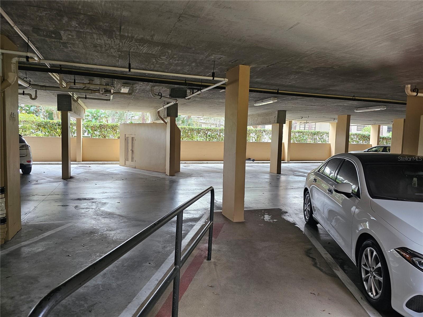 Covered parking with back entrance to elevator