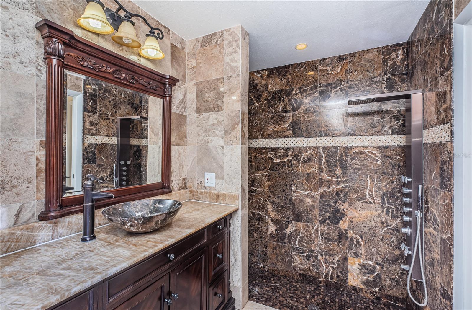 Master bath and shower with onyx counter and Peruvian marble tile.