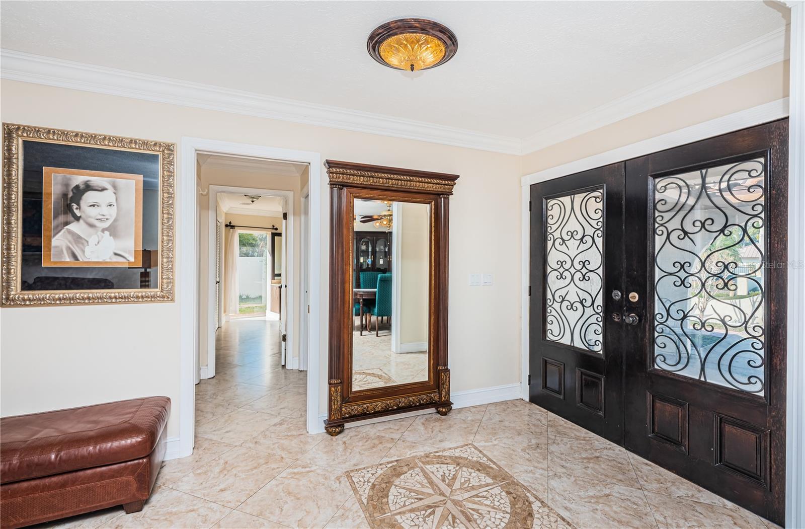 Foyer features Italian marble mosaic in the floor.