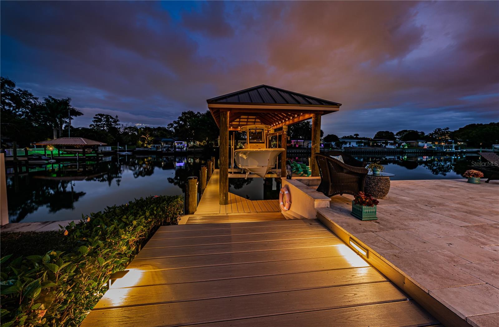 Well lit and landscaped yard and boat dock.