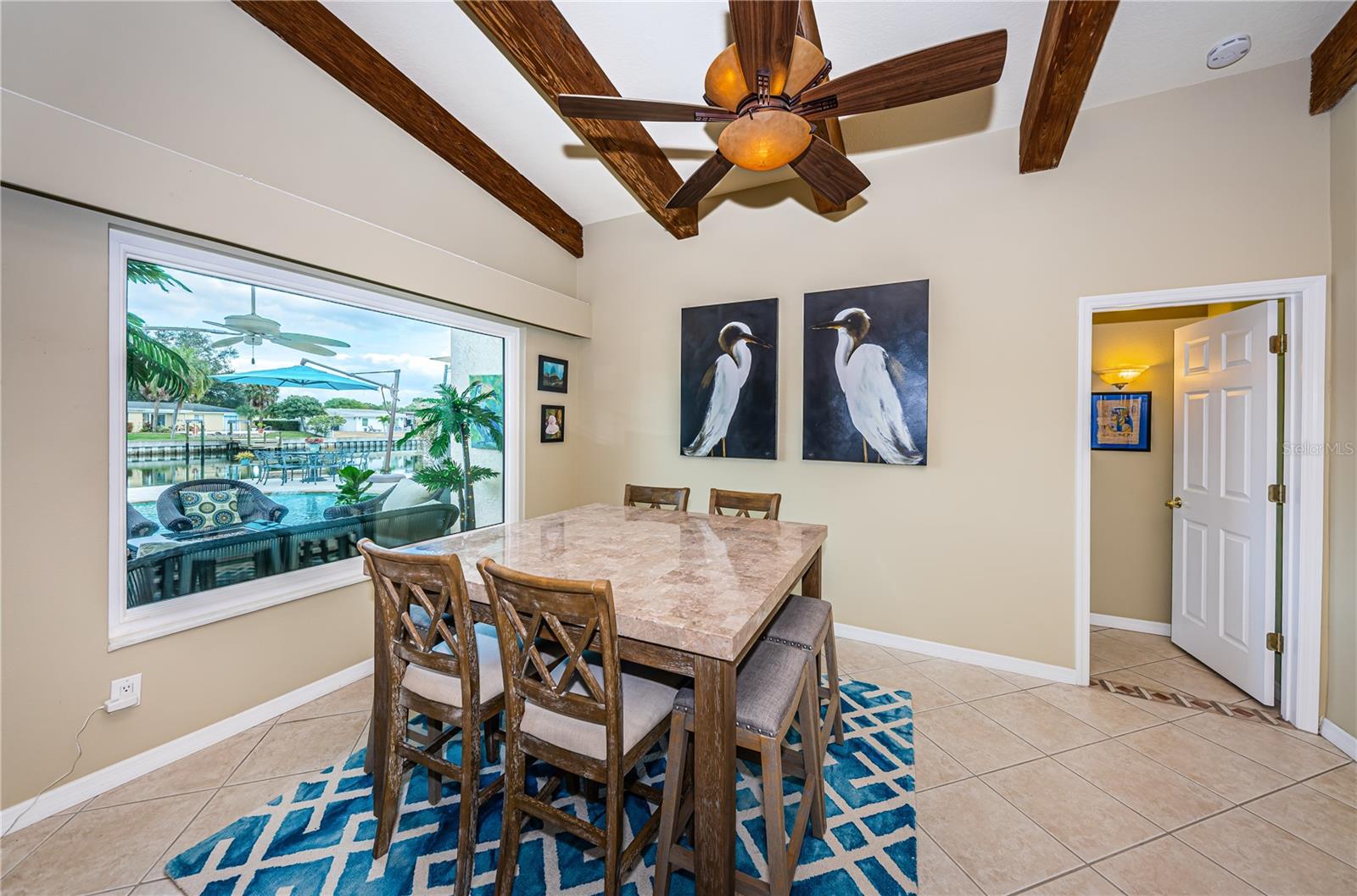 The huge dining room window is impact-resistant and offers safety in hurricanes.