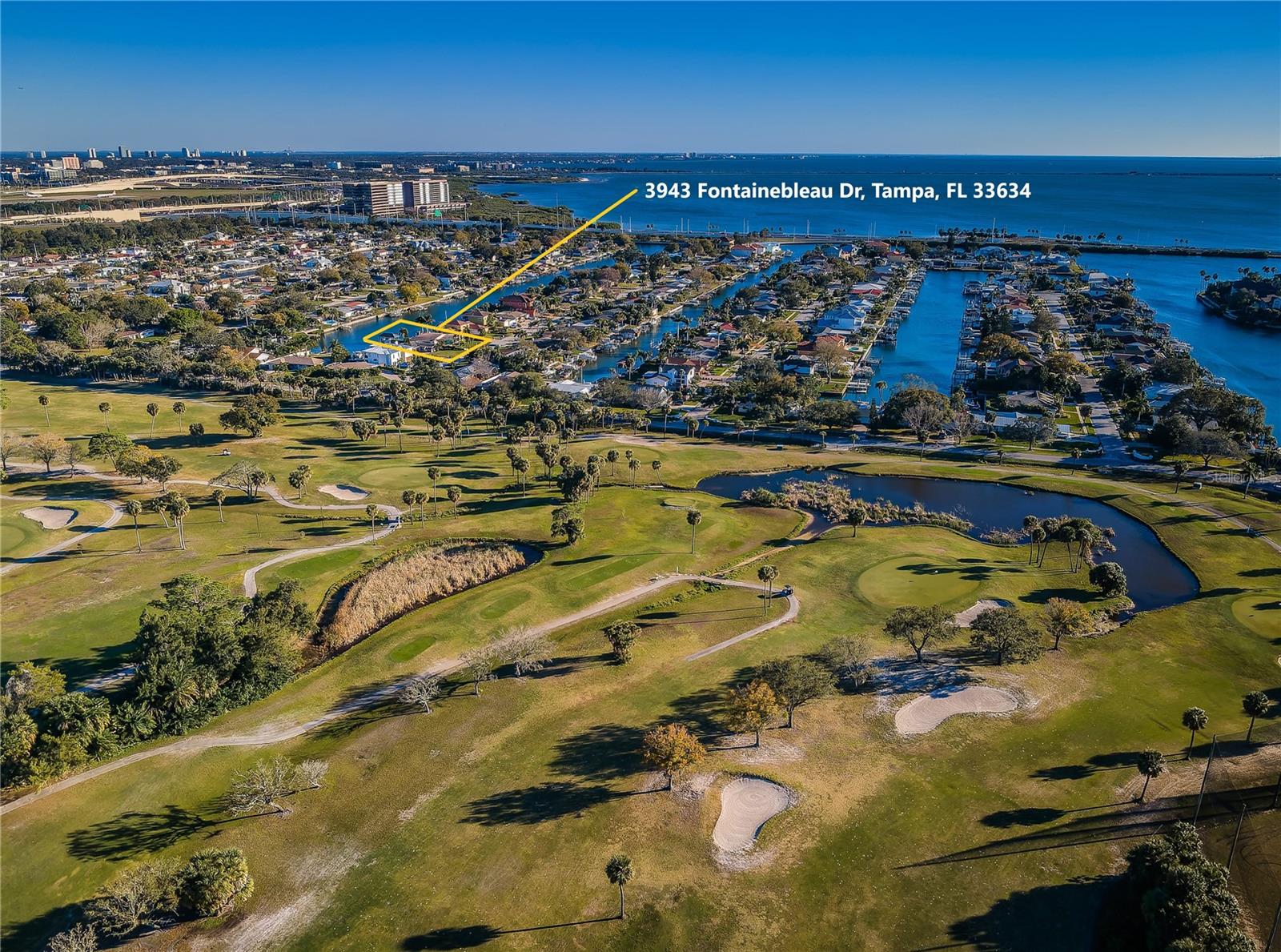 Gorgeous Fontainebleau adjacent to Rocky Point Golf Course on one of Dana Shores widest canals (hard to see due to angle of drone) with direct access to Tampa Bay.