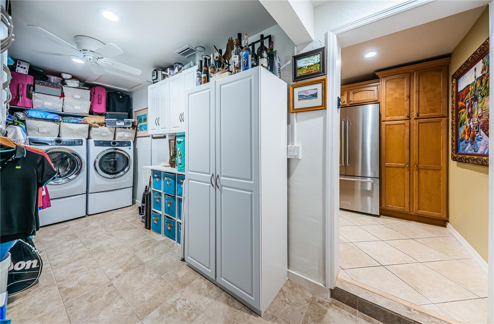 Large laundry room adjacent to the kitchen.