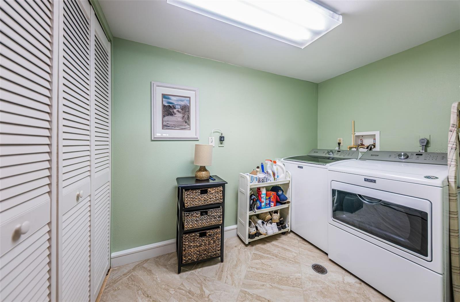 Inside utility room with full sized washer & dryer