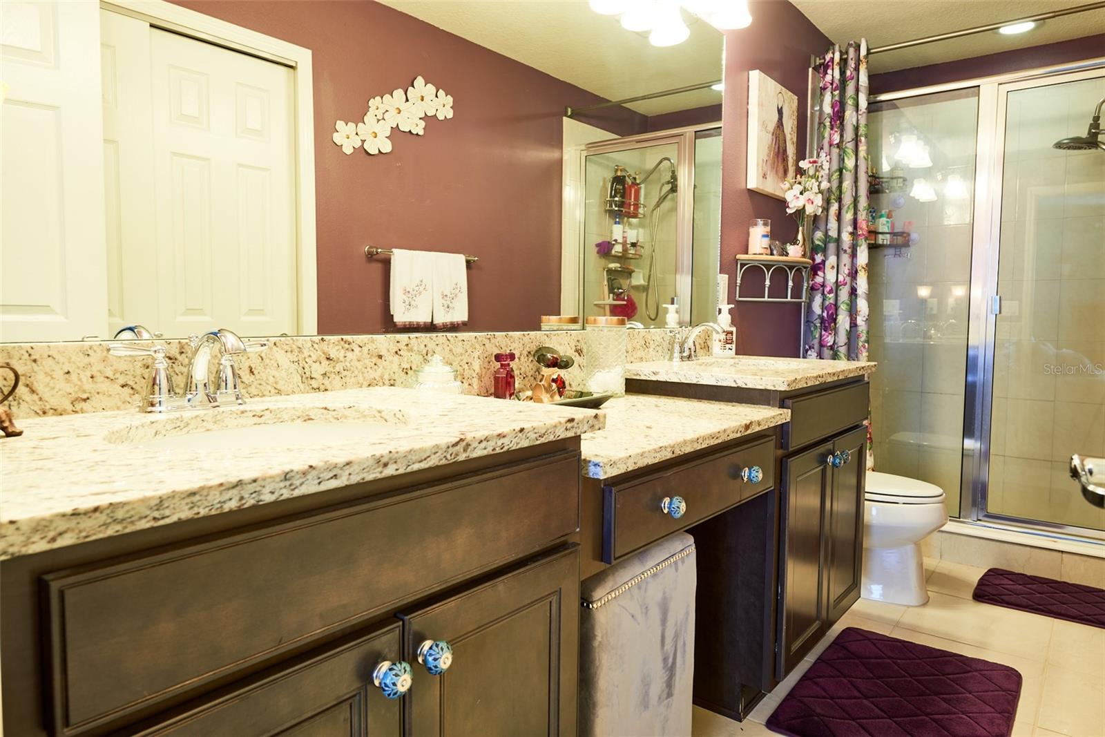 Master bath with double vanities and make up area