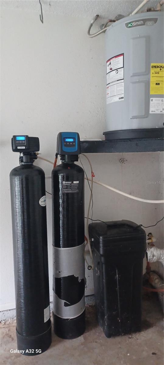 new water heater and water treatment system and laundry hook ups in garage