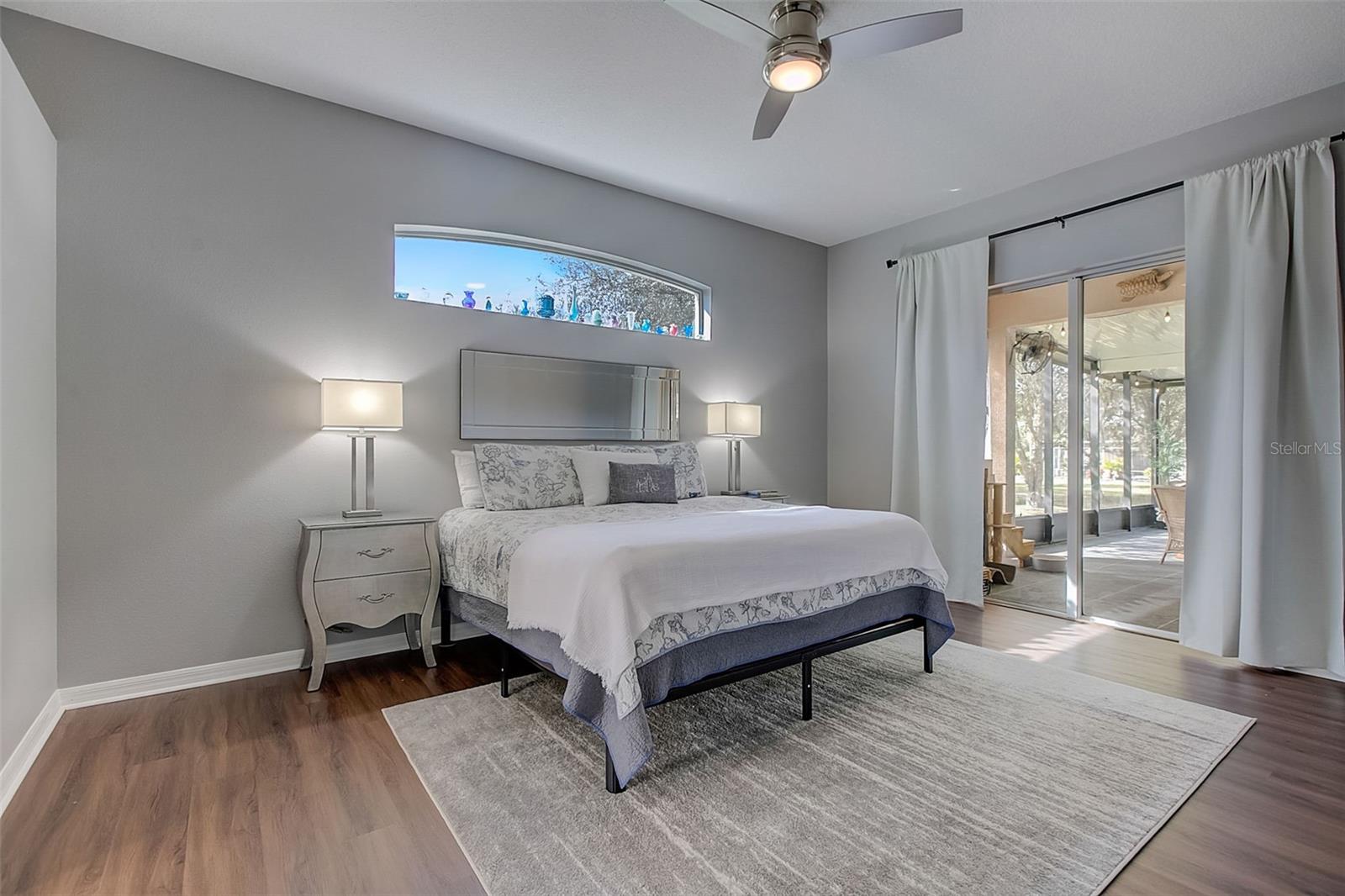 Spacious Master Bedroom with pocketing sliders out to lanai area
