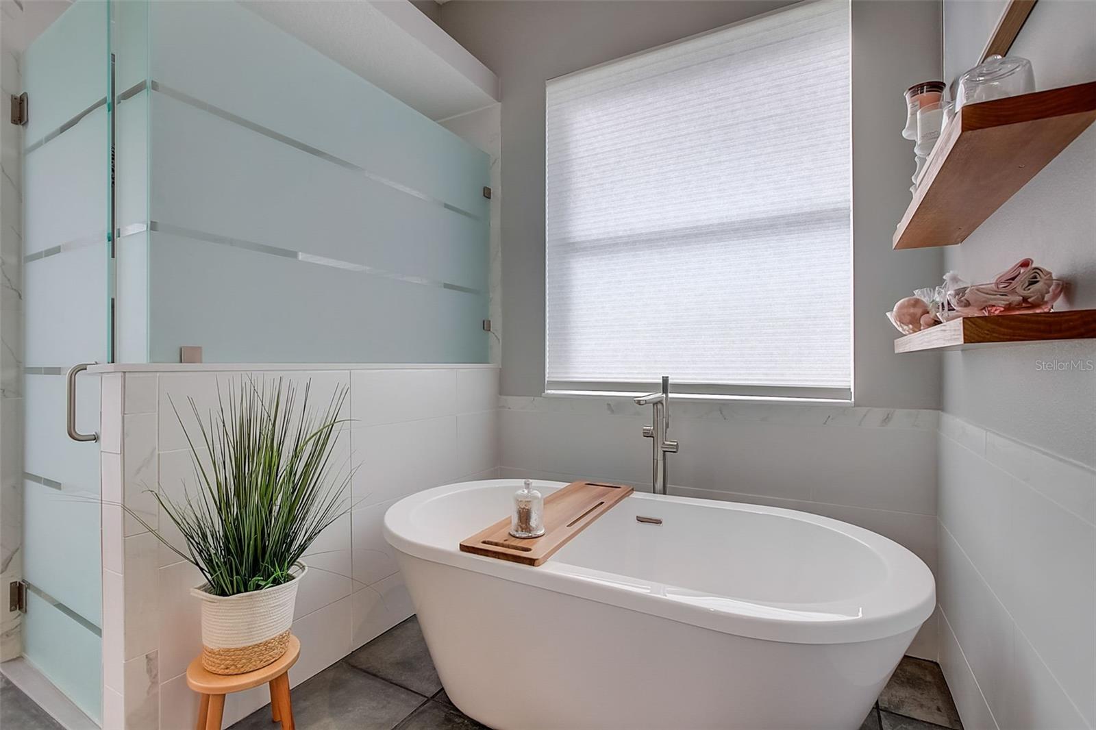 Relax and unwind in this soaking bathtub