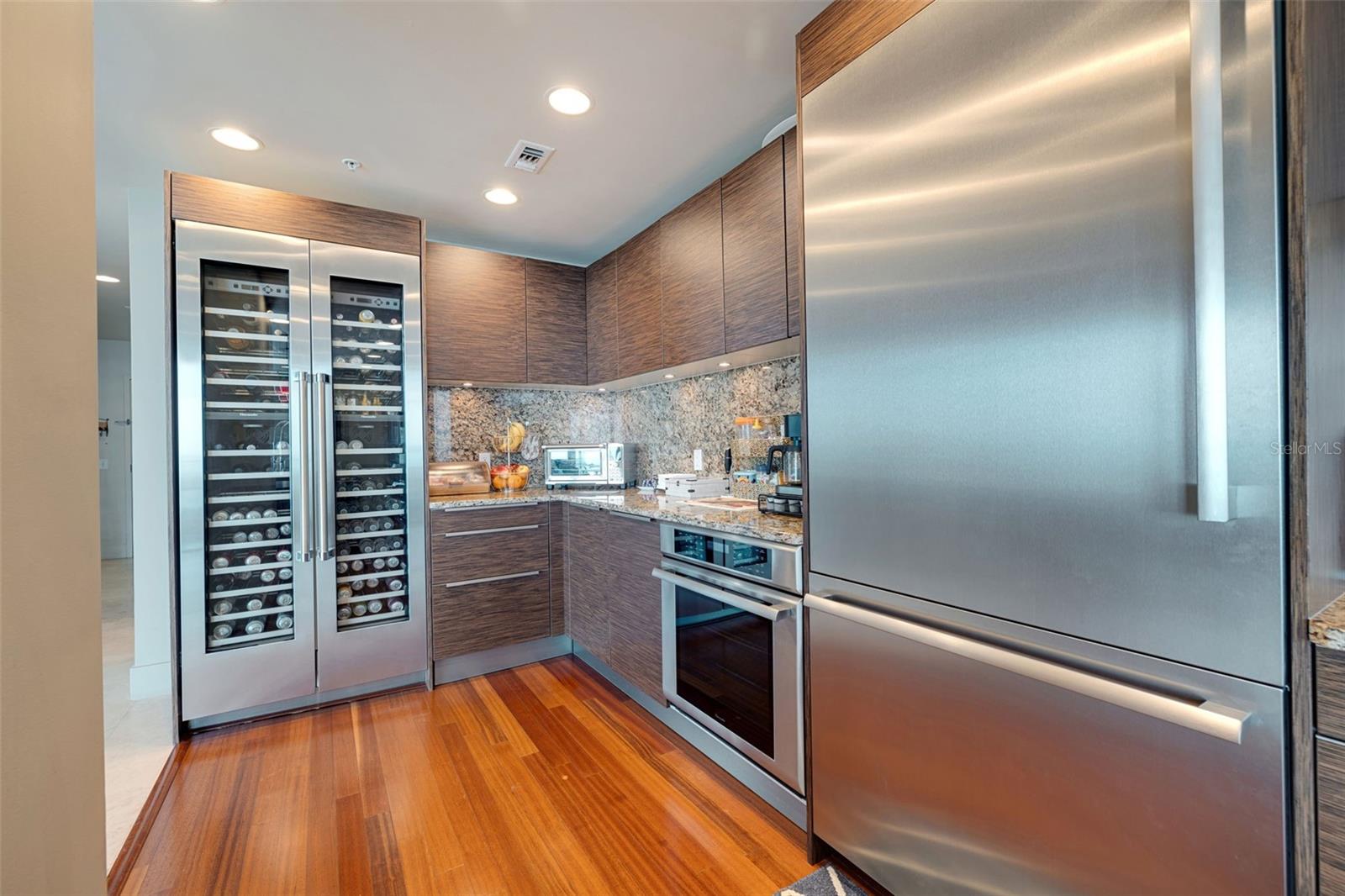 Double door wine fridge, built in oven, oversized refrigerator, all Thermador Appliances