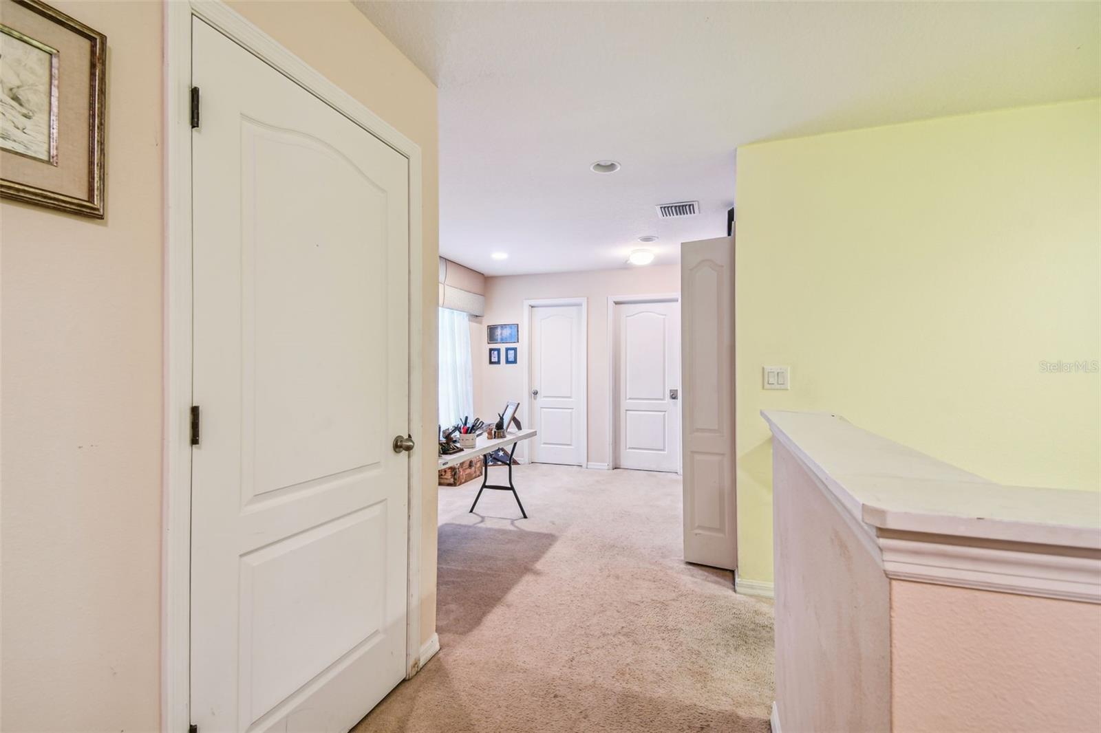 Door to second bedroom/Hallway to Loft
