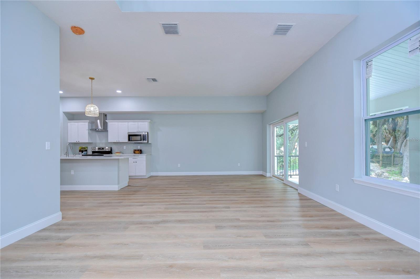 Natural light fills the downstairs and the blond floors add a sense of spaciousness.