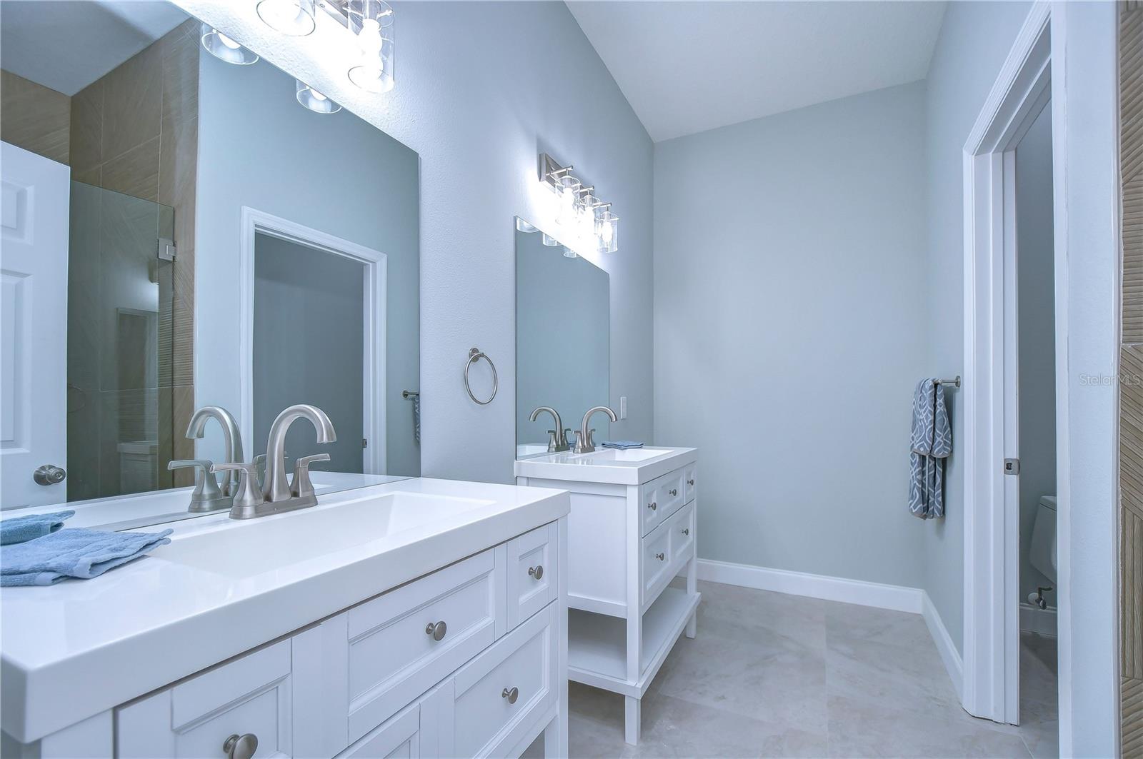 Separate Vanities in the master bathroom makes getting ready for work or date night a snap!