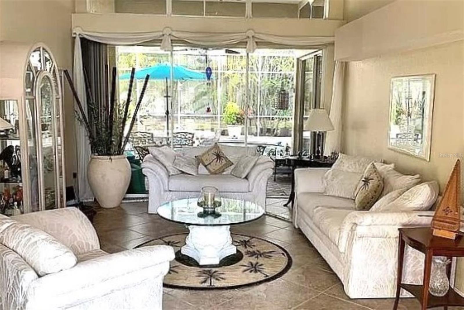 Nice living room with Sliders and pool view