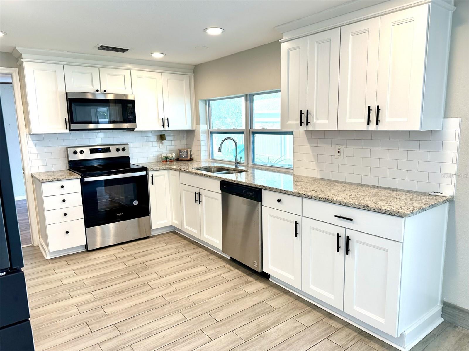 Beautiful Kitchen with granite countertops and lots of storage!