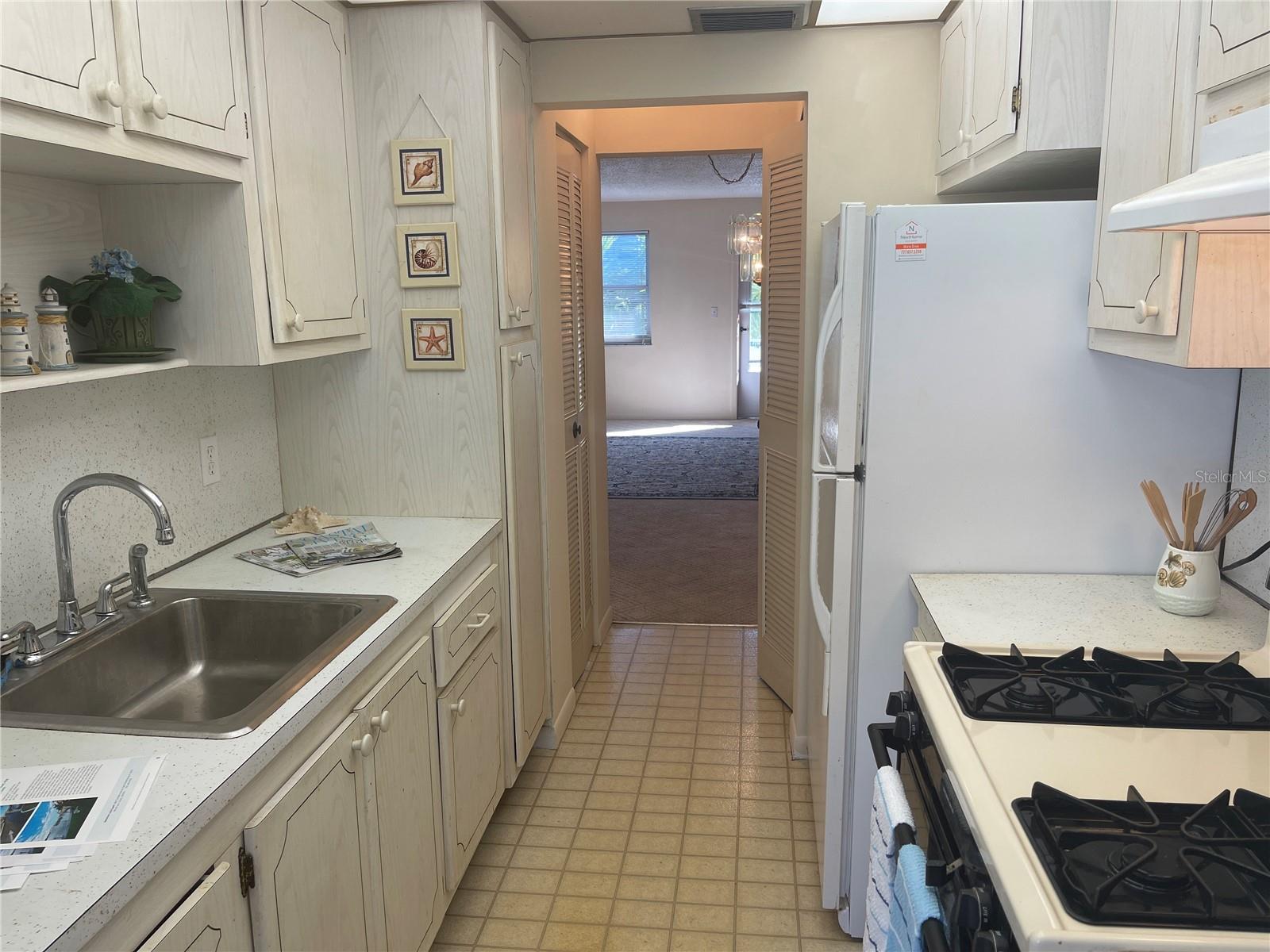 Spacious galley style kitchen is just off the dining area and leads to the Florida room.