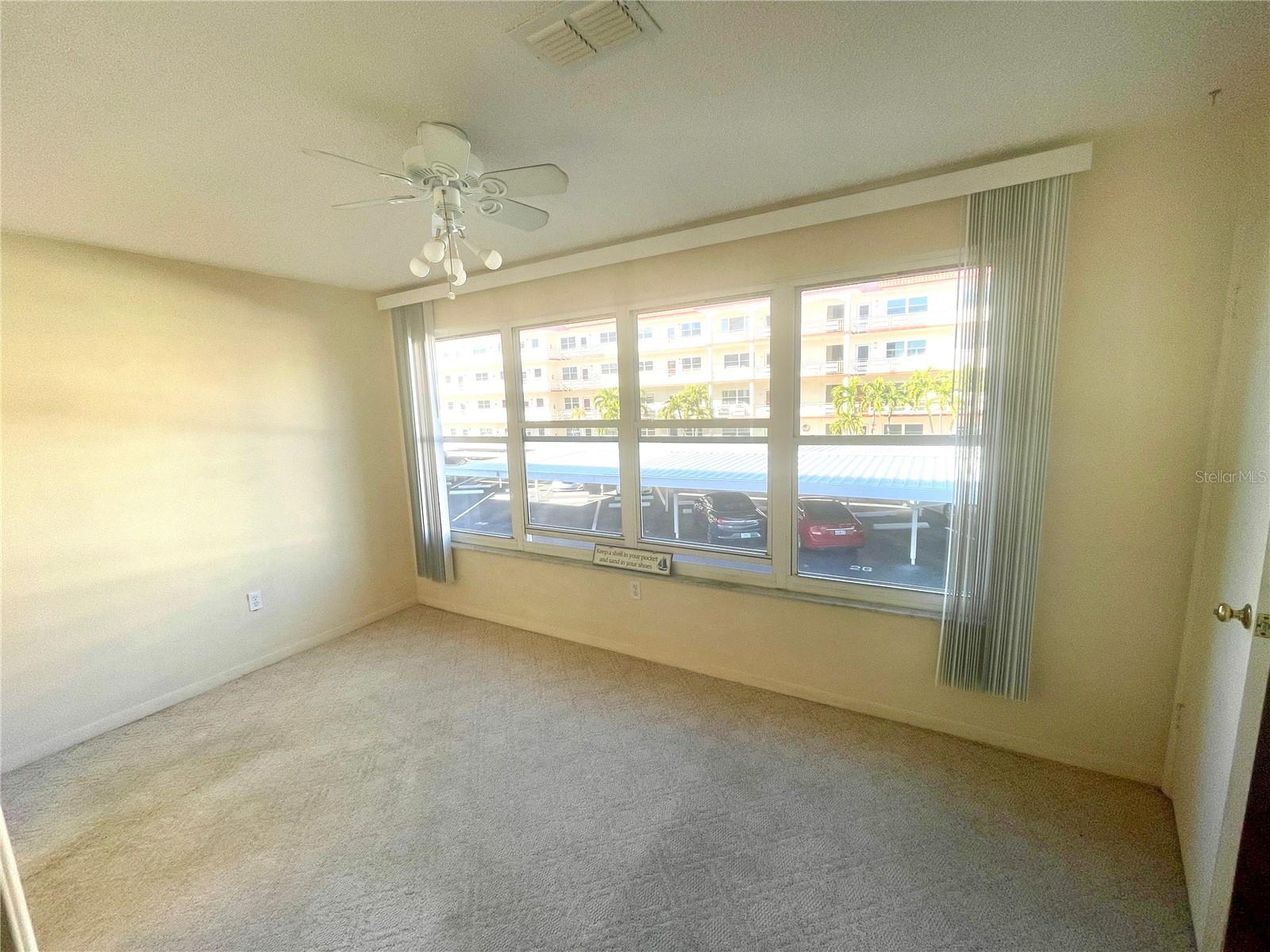 Sun filled Florida room with partial view of the water!