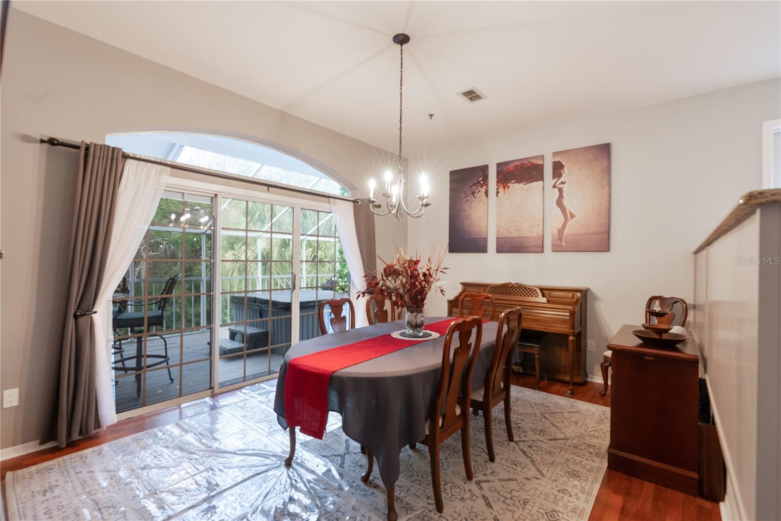 The formal dining room overlooks the conservation area. Large buffet of cabinets and stone counter tops separate the dining room from the kitchen making this ideal for entertaining guests.