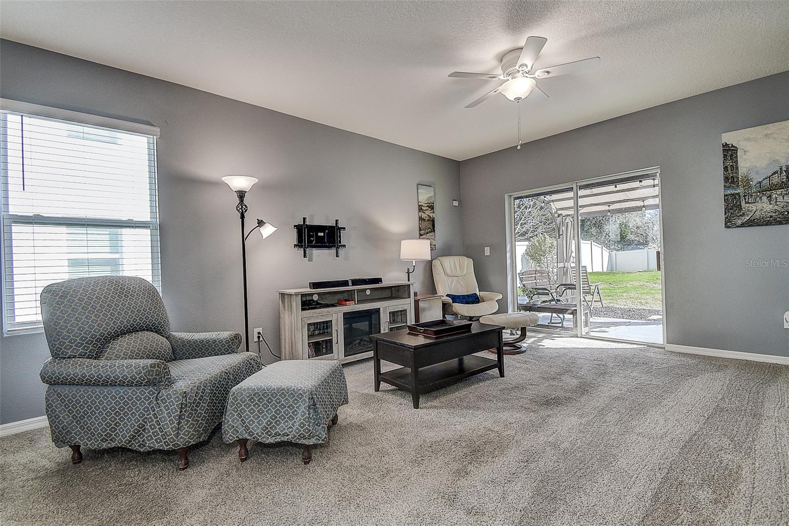 Plenty of room in the living room with easy access to the fenced back yard.
