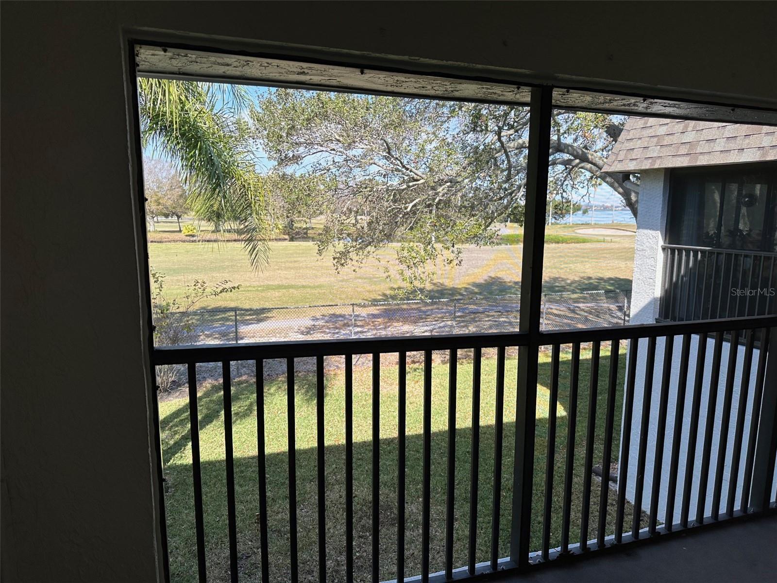 Screened Porch/Balcony with view of golf course and Tampa Bay 2nd Floor