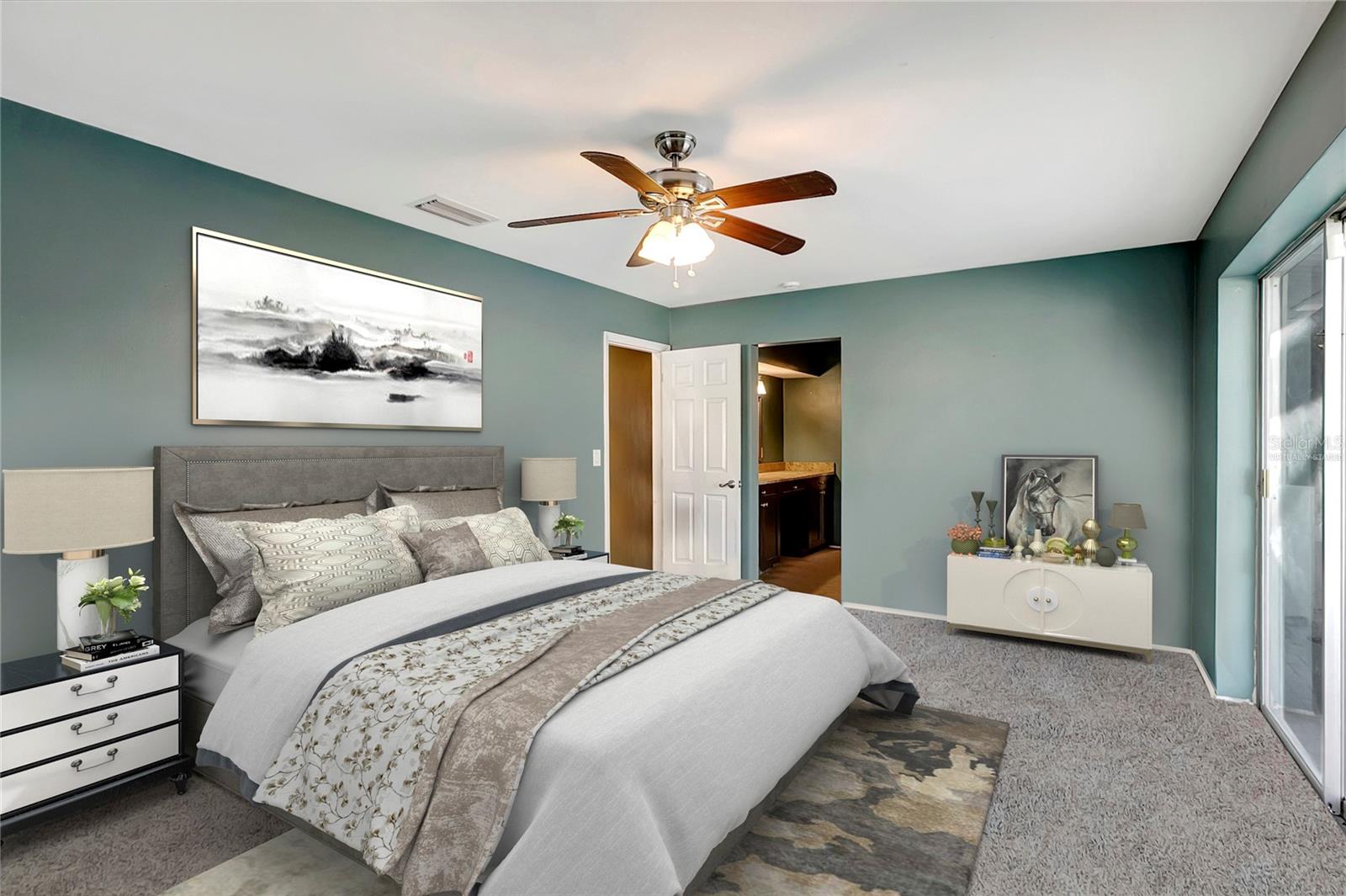 virtually staged- master bedroom has since been painted a neutral color and had new carpeting installed