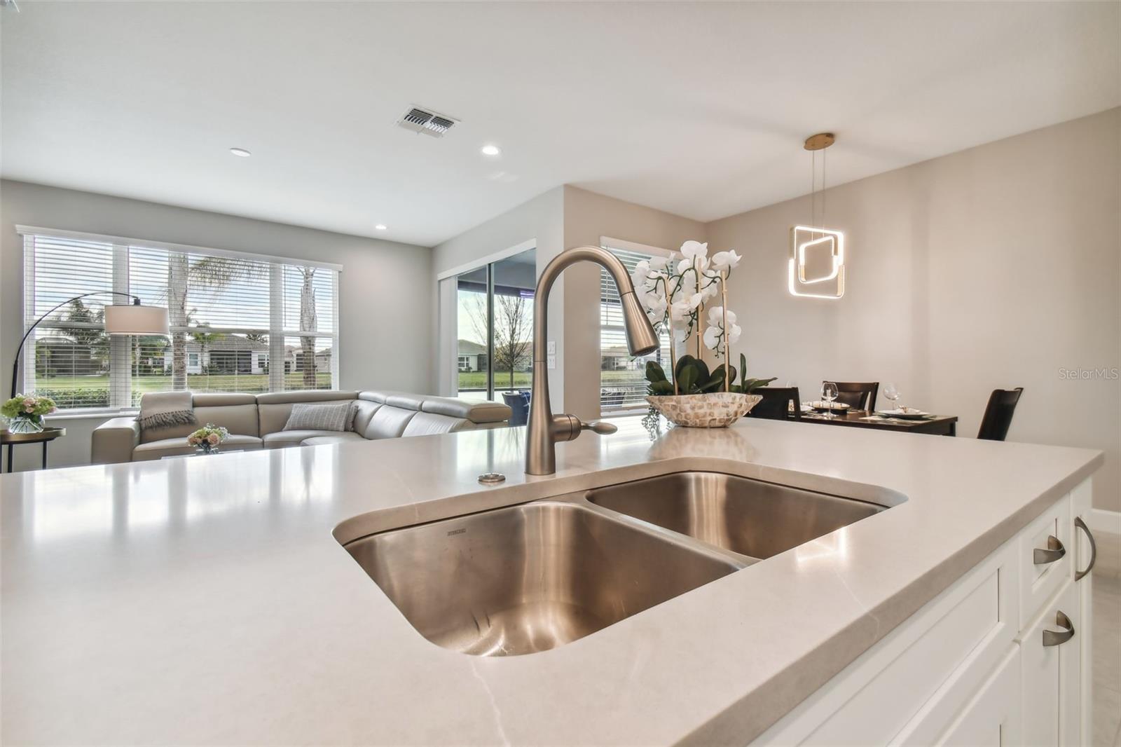 50/50 stainless steel sink with quartz countertop.