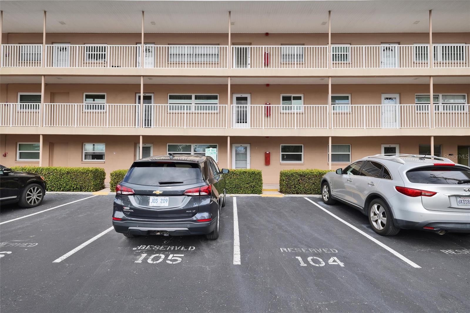 Parking space 105 is assigned directly in front of the condo.