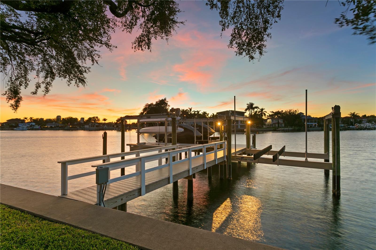 This updated dock was built by Speeler and has a Neptune 24,000 lb G6 Super Fast boat lift and jet ski lift.