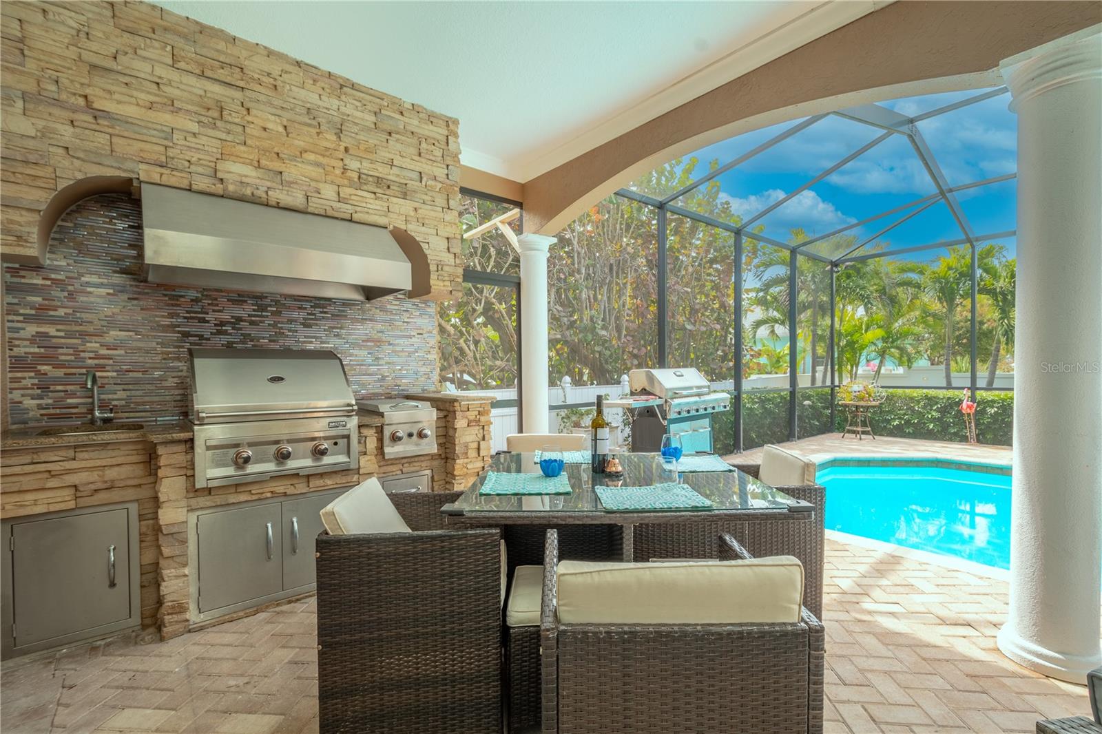The covered patio has plenty of room for all of your outdoor furniture.