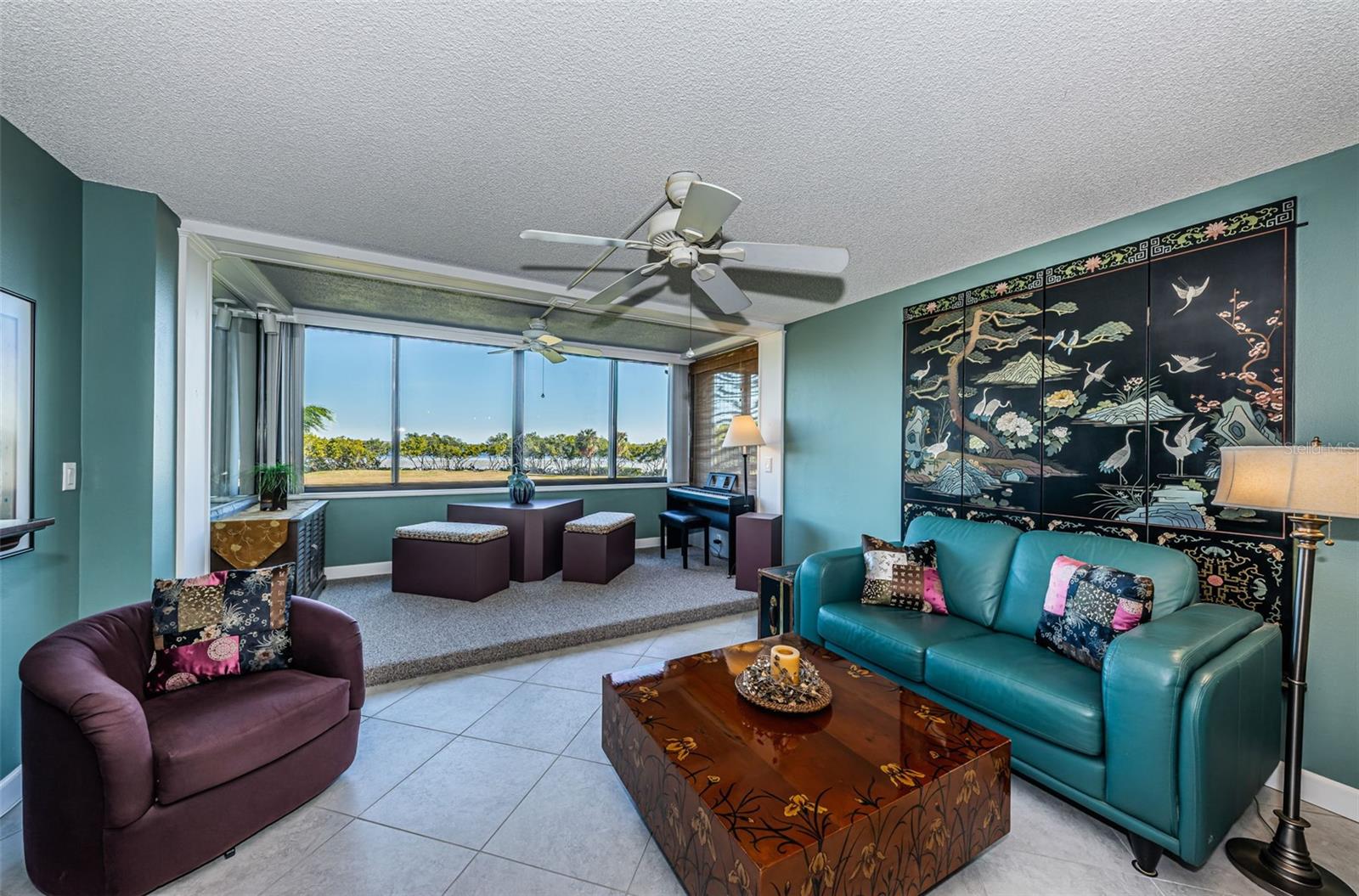 Living area with full view of Tampa Bay and 17th golf hole