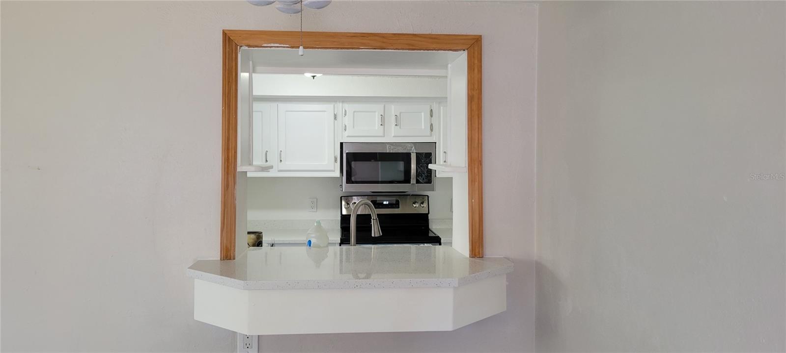 Convenient pass through window into kitchen