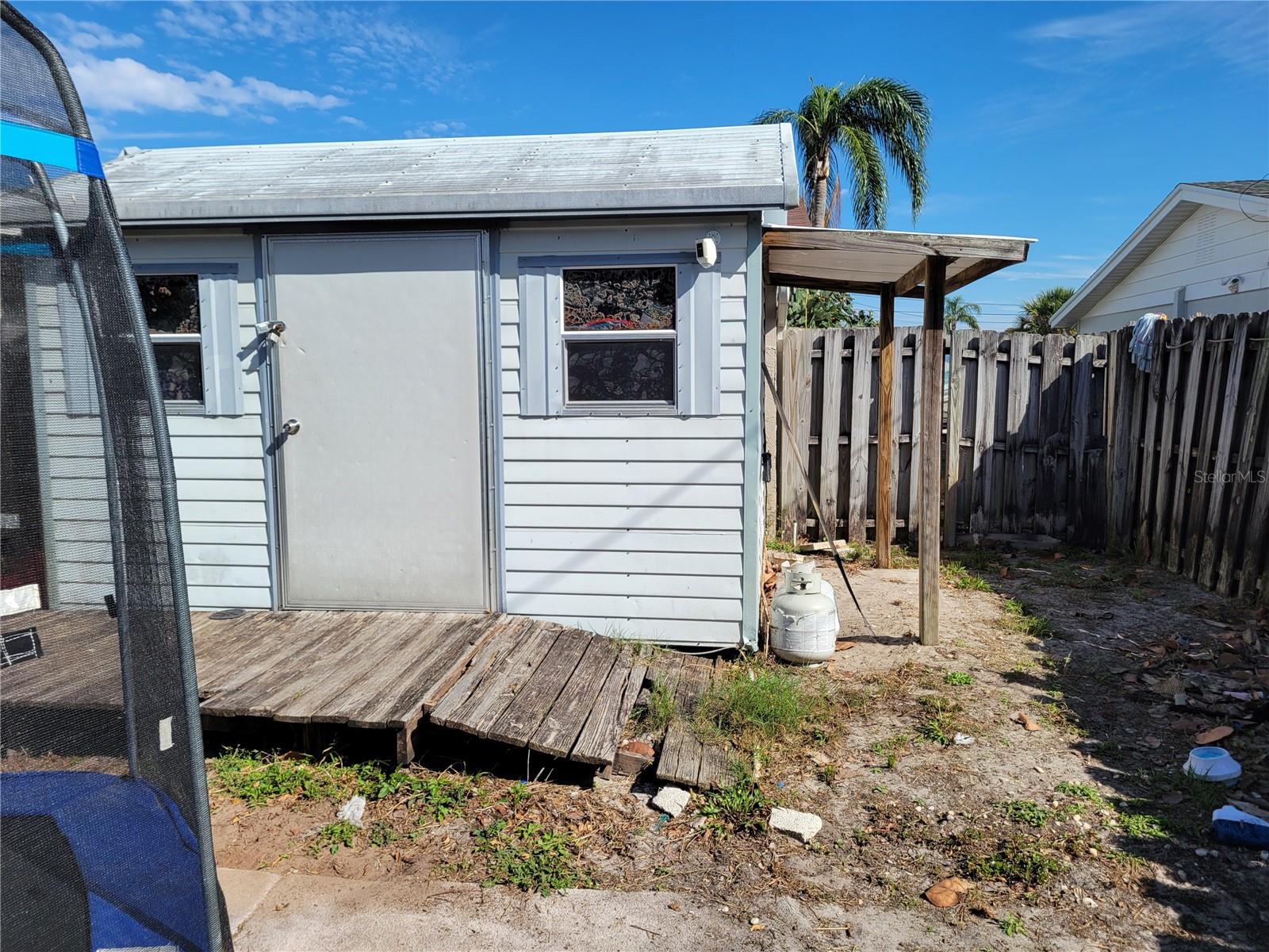 Storage shed out back for all your toys and tools.