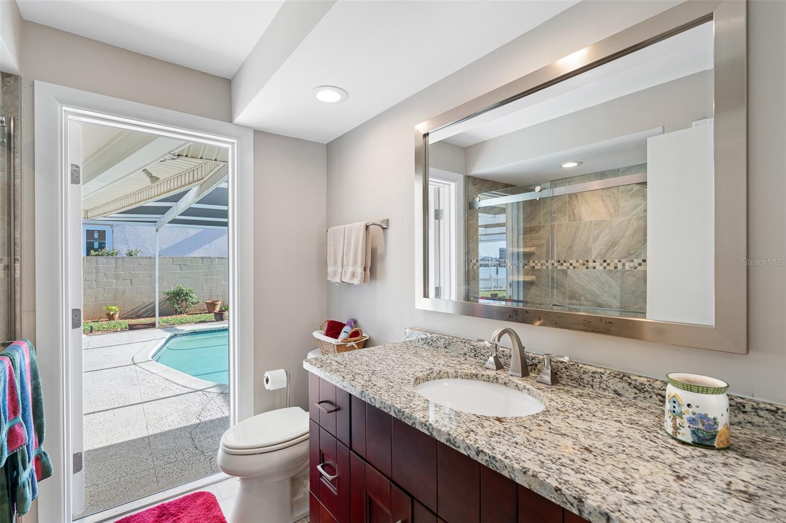Guest bathroom is accessible from the pool/lanai.