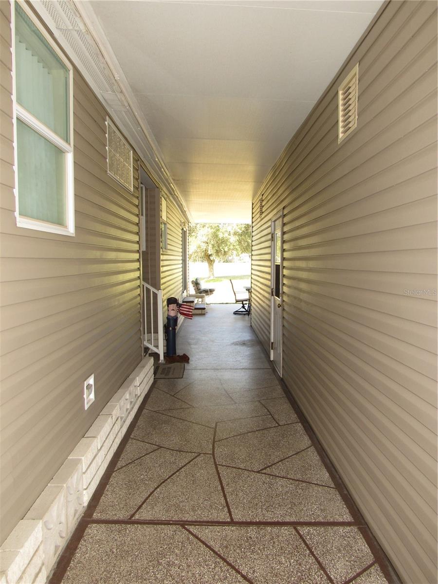 Wide breezeway to main entry & covered porch.