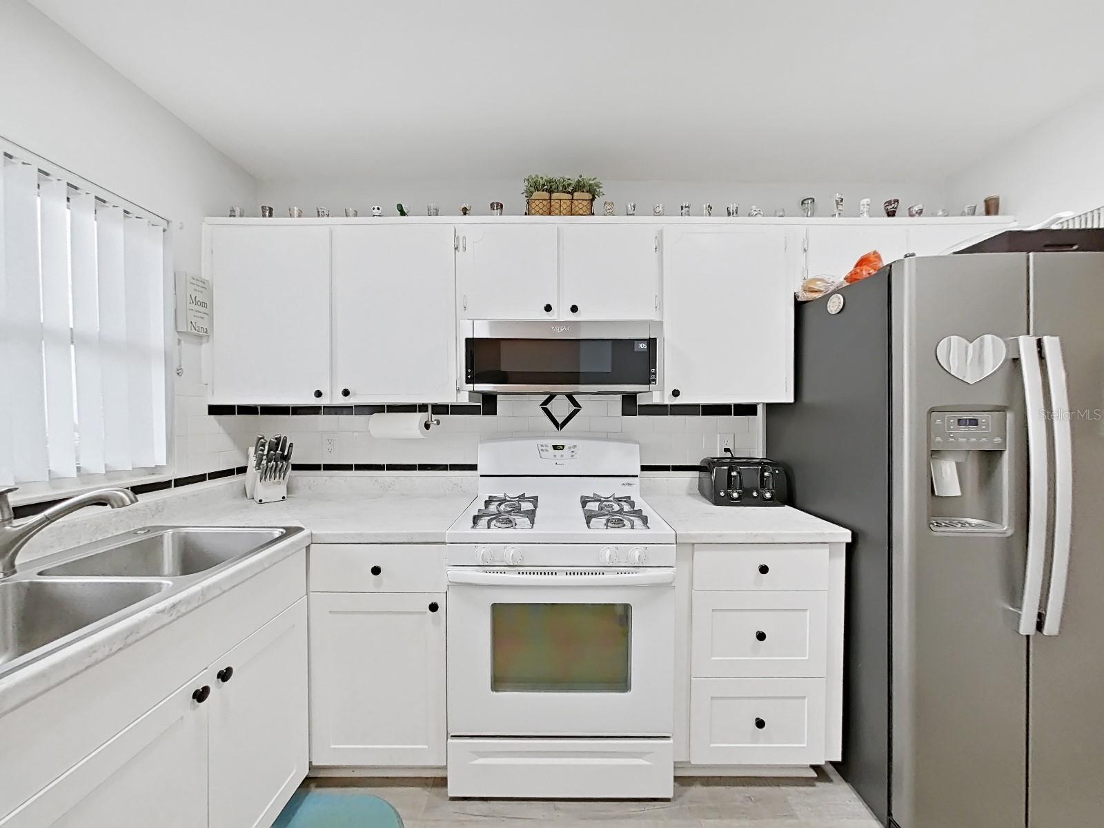 Upper and lower cabinets and a gas range! Remember your gas is included, no cost to you!