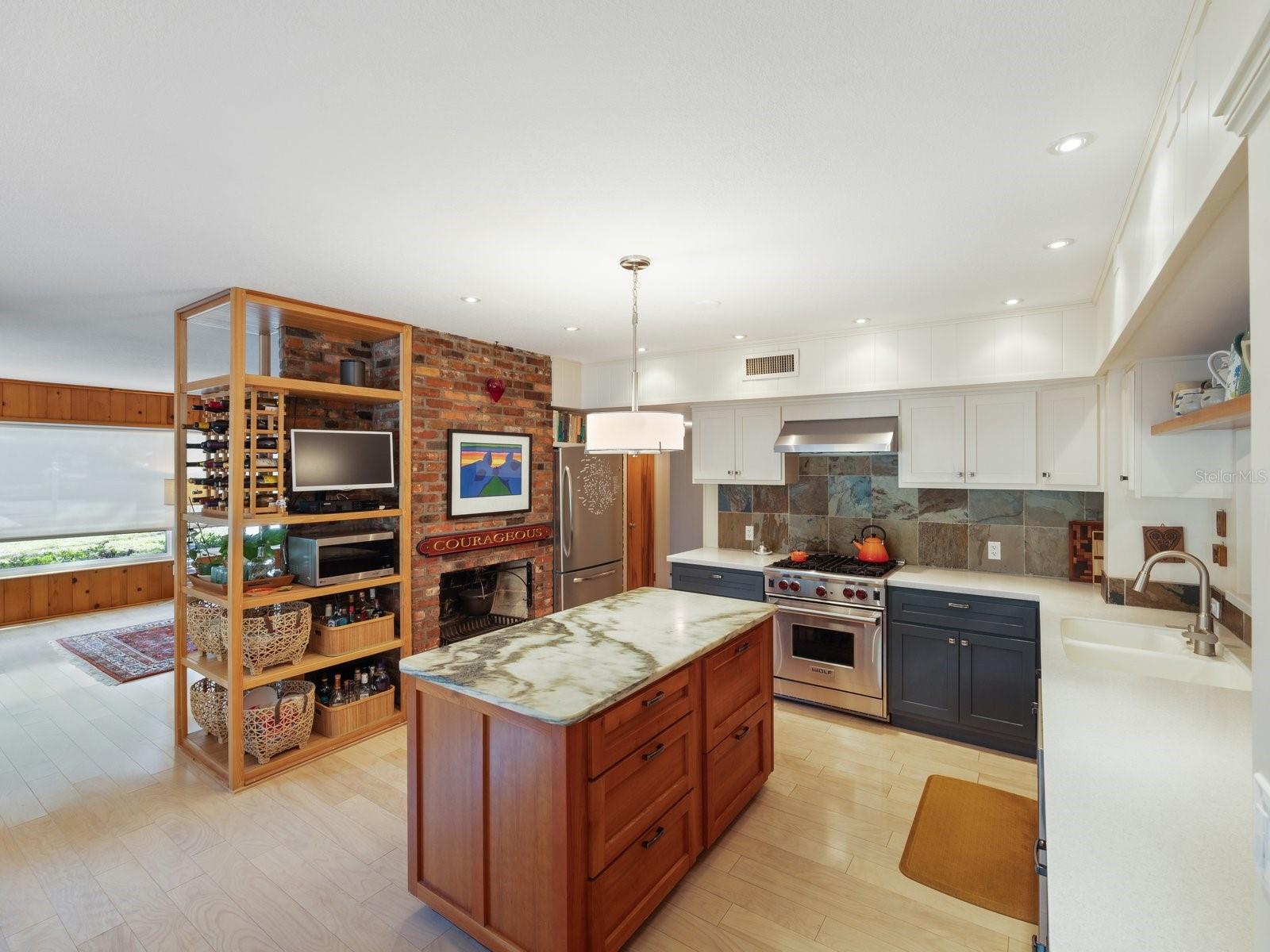 Kitchen with island and custom shelving