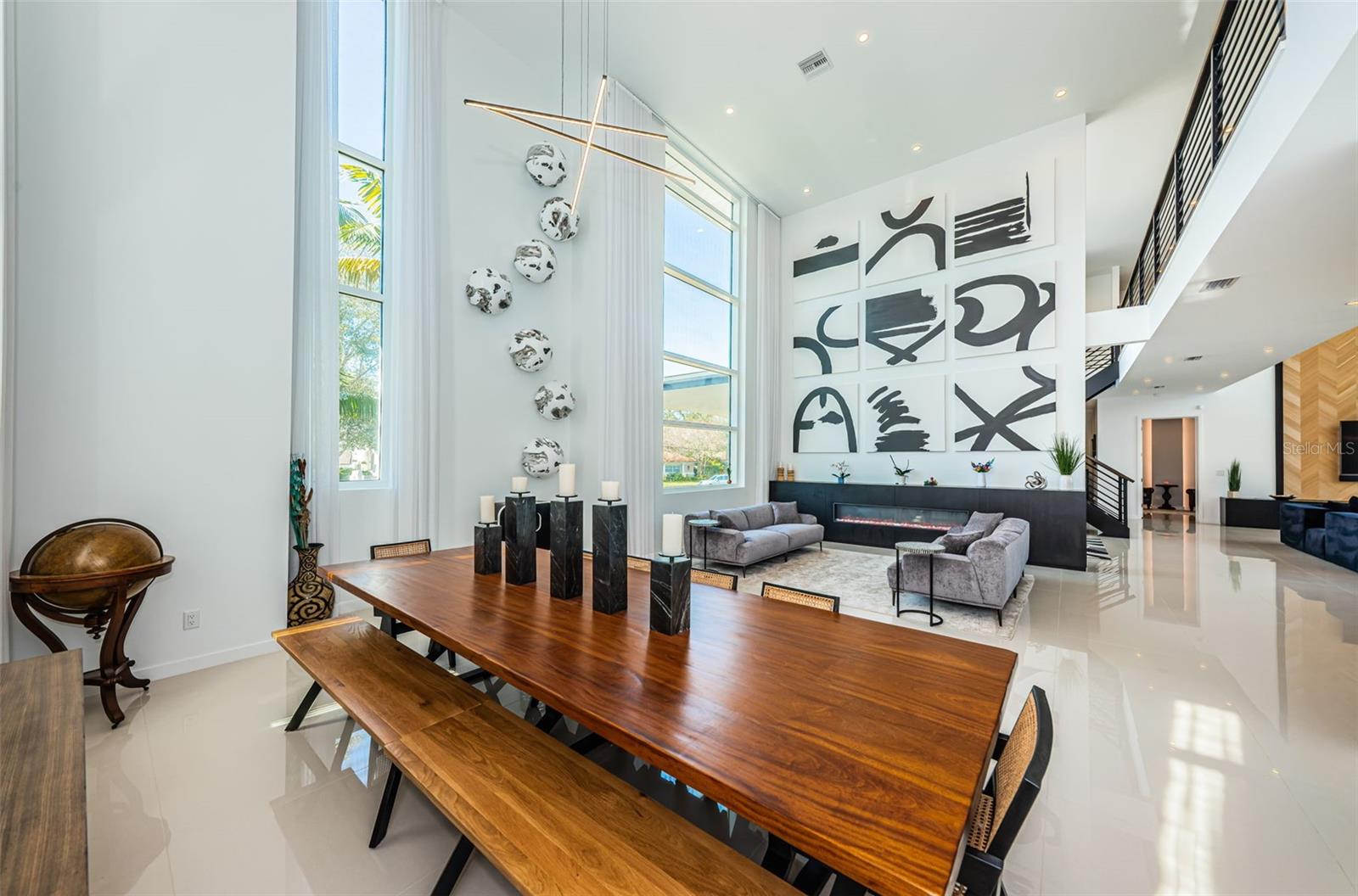 A fabulous Entertaining / Dining space flows seamlessly from the Kitchen and Great Room.  Soaring ceilings, tons of natural light and a gas fireplace further enhance this wonderful space.