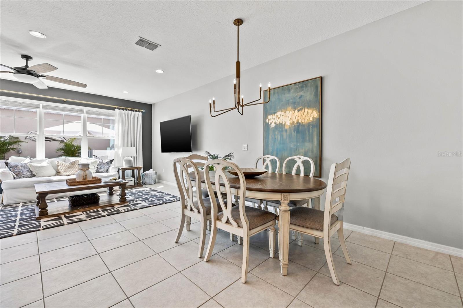 Featuring the spacious dinning area with upgraded light fixture from Pottery Barn.