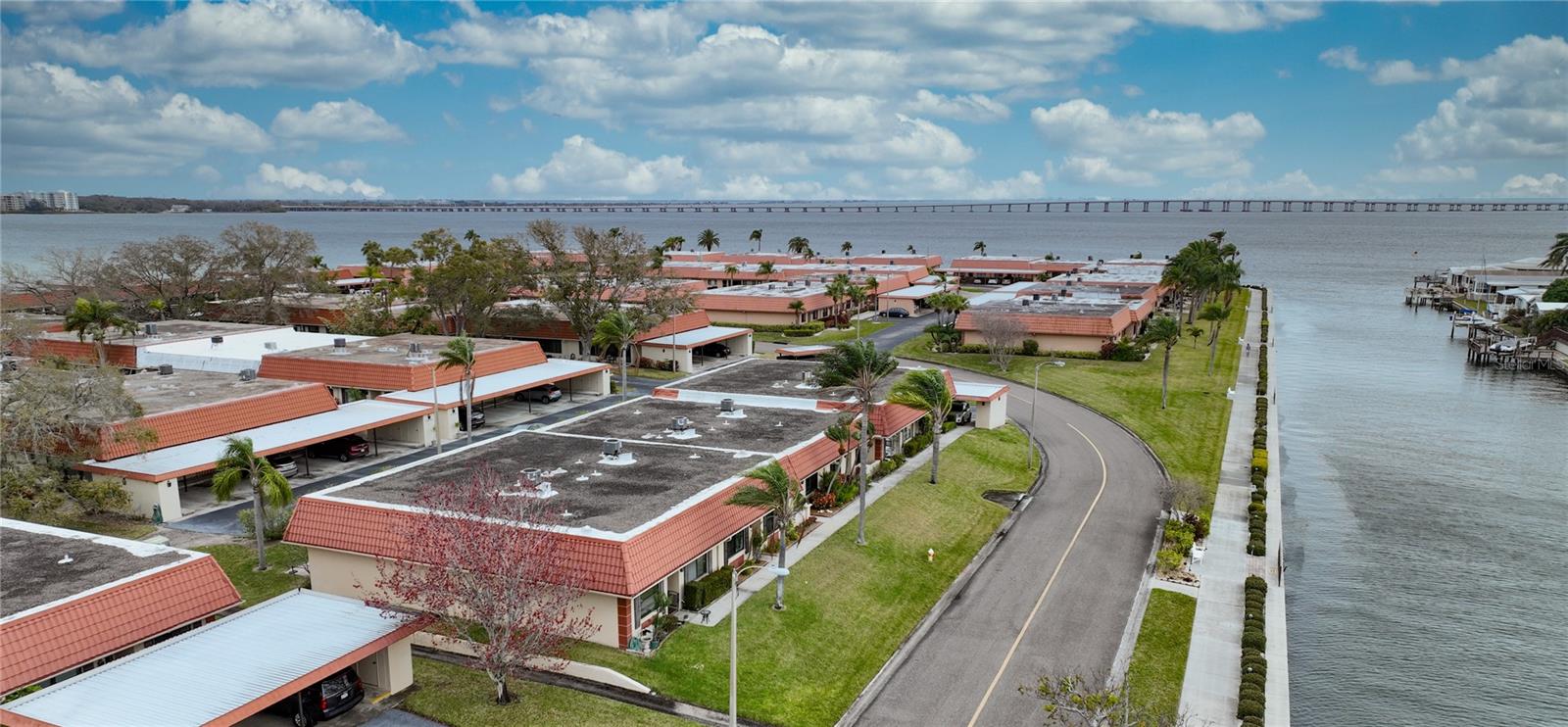 Aerial views of building 21, canal, bay and walkway around the community.