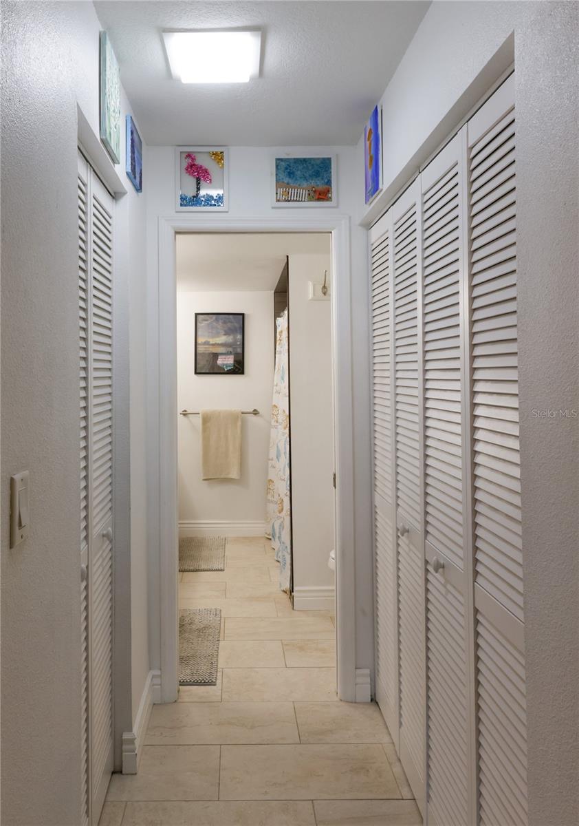 Dual closets in hallway to en suite