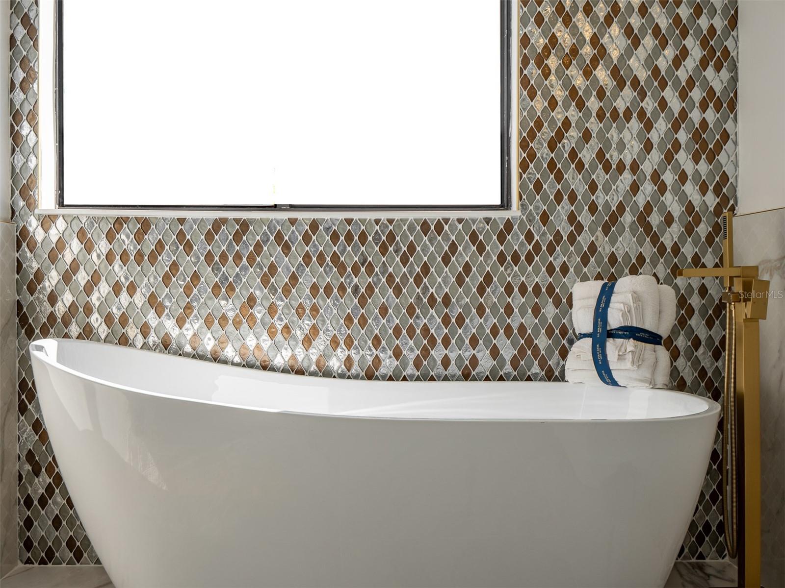 Standalone tub in primary bathroom