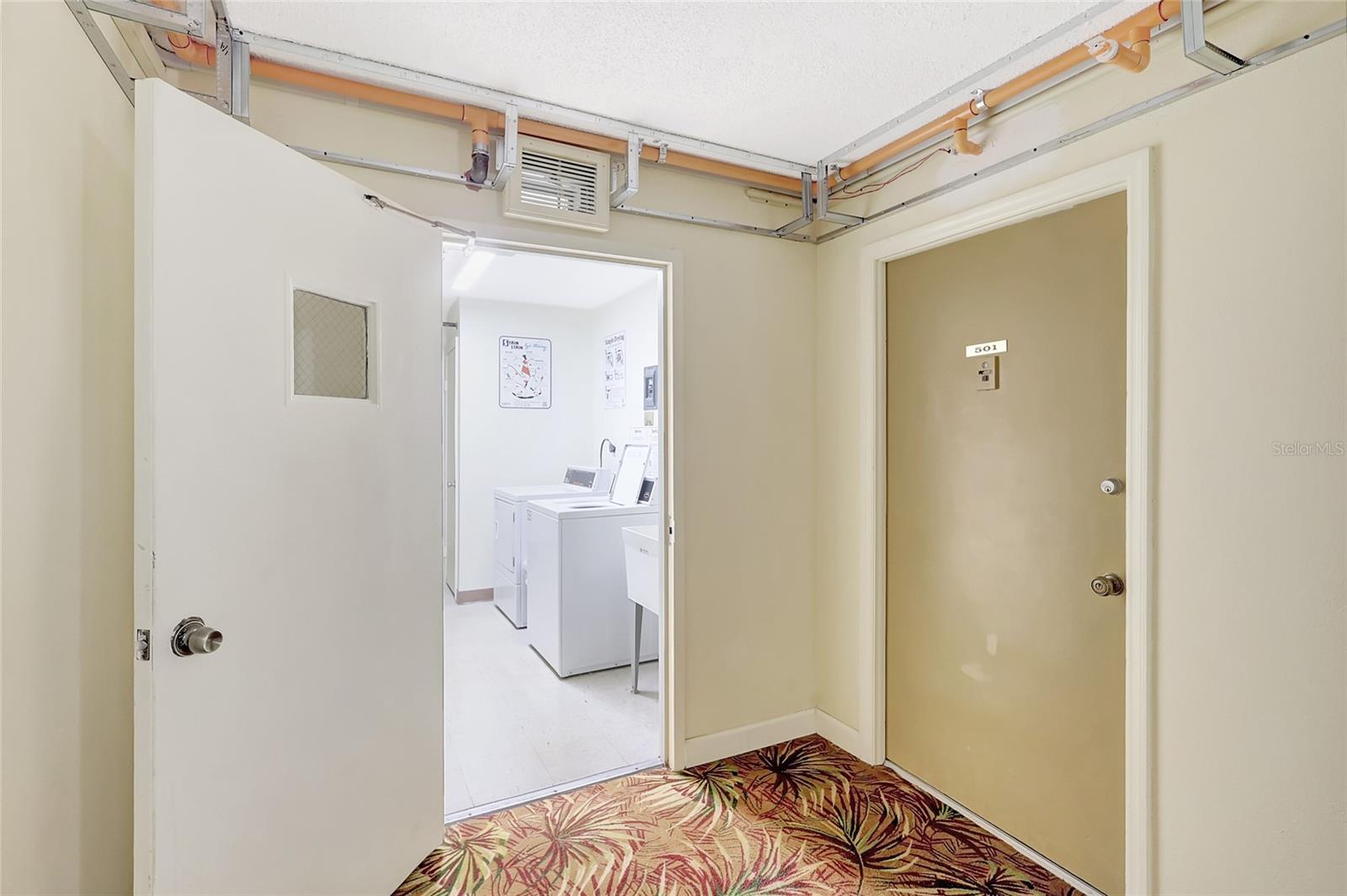 Laundry room is right outside your door.