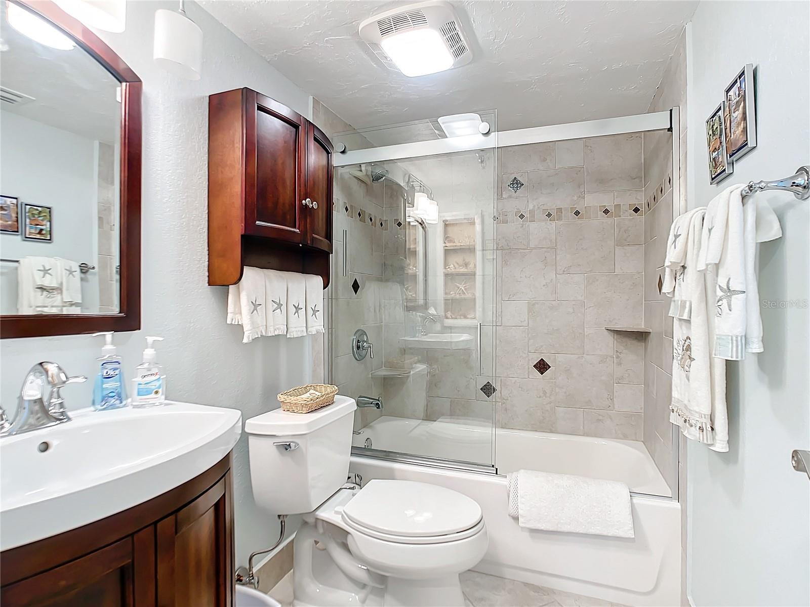 Hall bathroom with shower/tub combo.