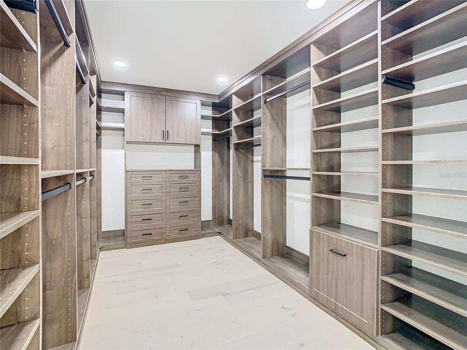 Primary Suite Closet with California Cabinetry
