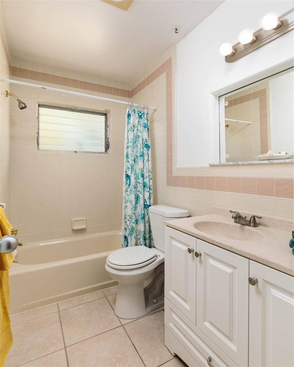 2md bathroom with tub and shower