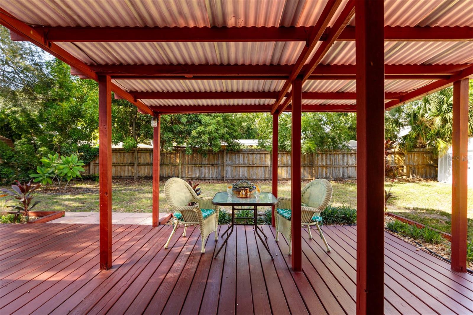 Shady backyard and covered porch breezy delightful space to enjoy