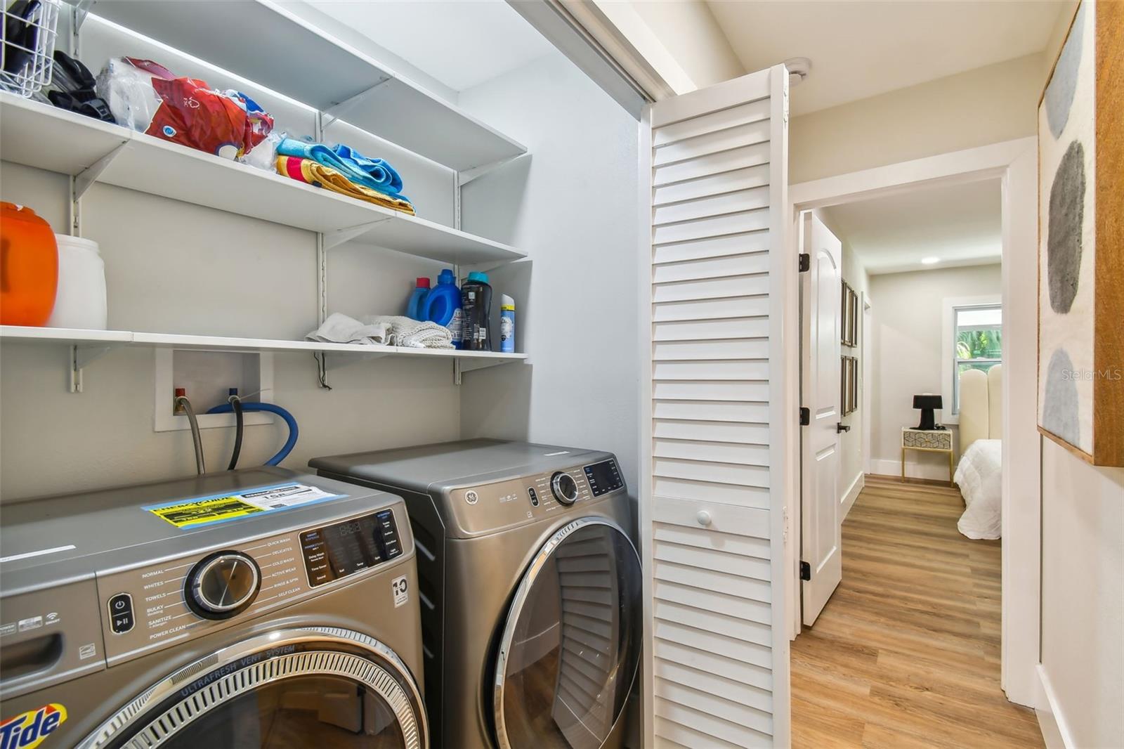 Laundry closet in corridor with easy access from all bedrooms.